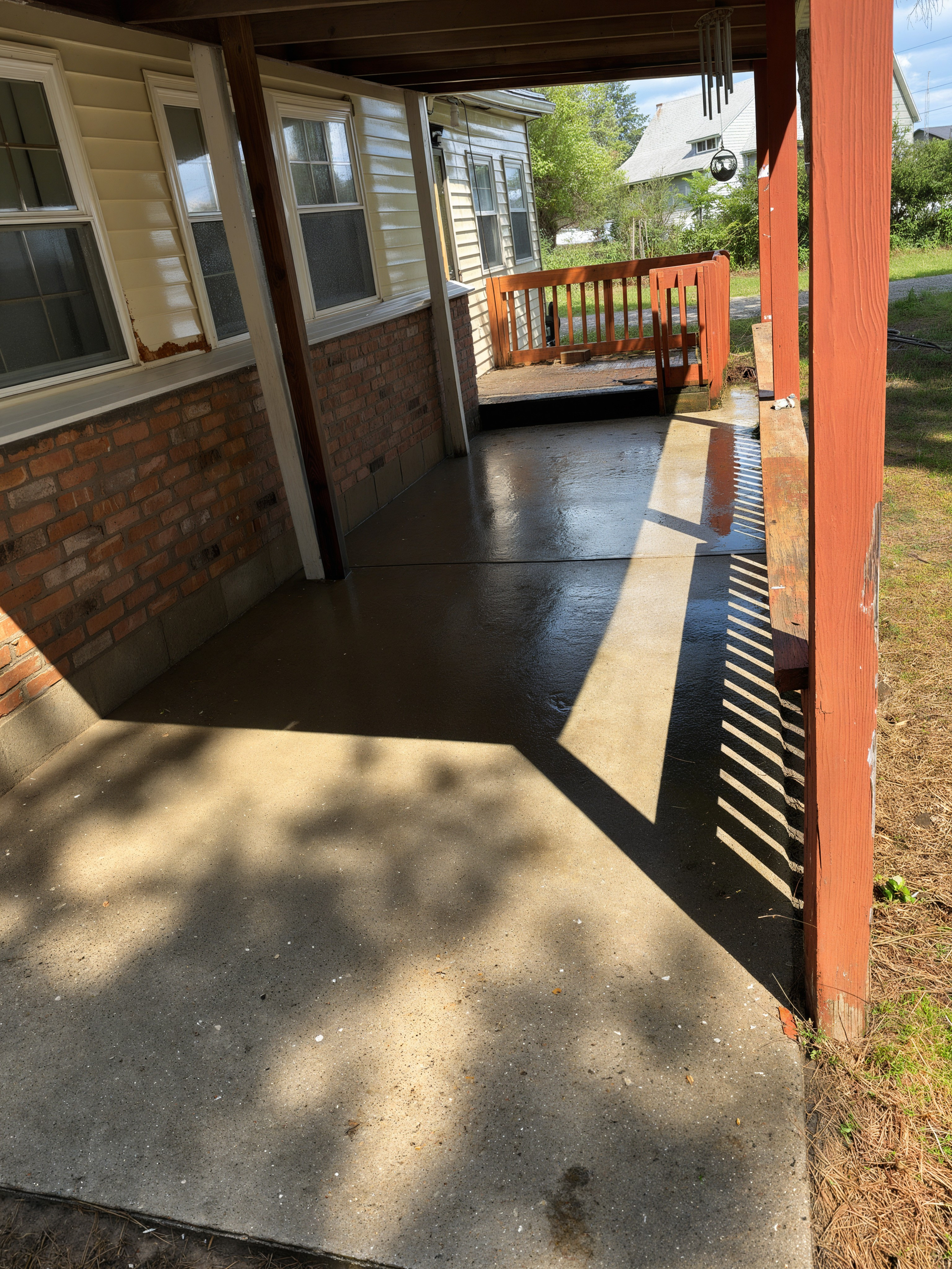 After: porch cleaned, brick house with red posts, Mt. Pleasant area